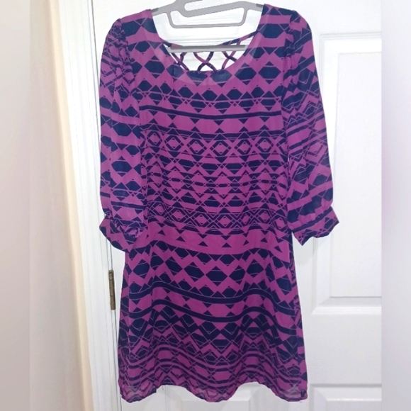 Accidentally In Love Dresses & Skirts - NWT gorgeous purple/pinkish dress with unique pattern and cut outs PTP 17" L 33"